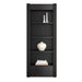 Styled shelf display on Crate & Barrel Siena 34" Black Wood 4-Shelf Storage Bookcase with Drawer with books vases and decor