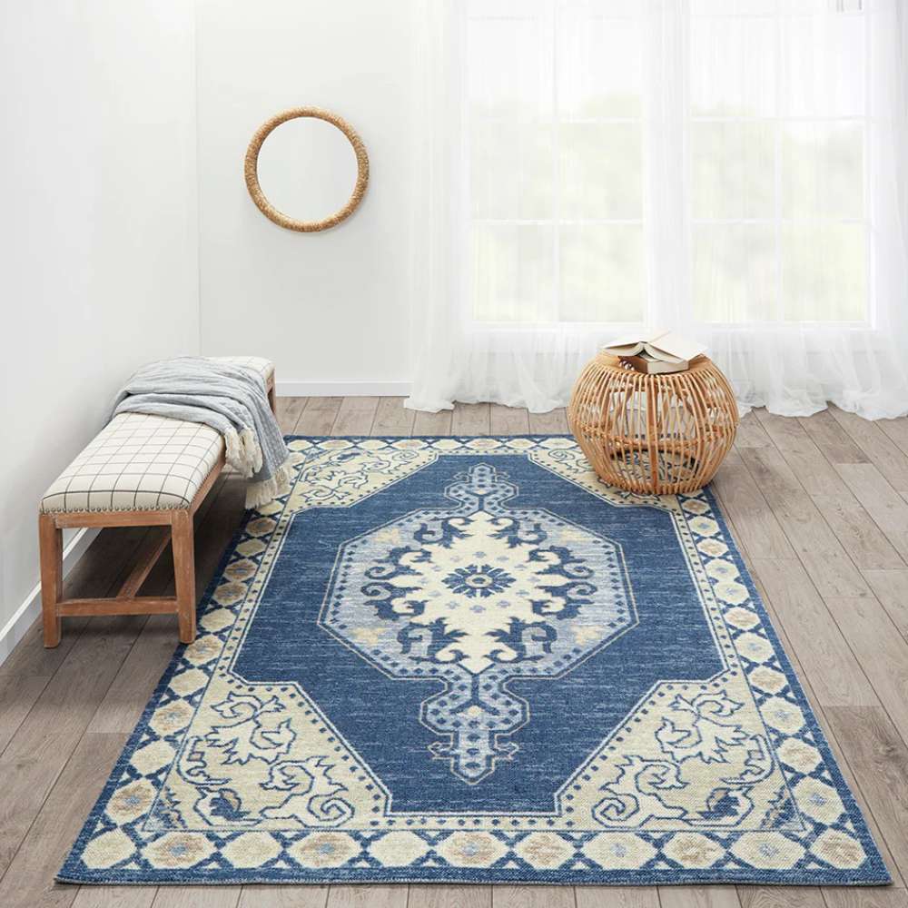 Styled in a bright room, the Momeni Anatolia Indoor Rug - ANA-3 Navy brings elegance with its navy and cream geometric patterns