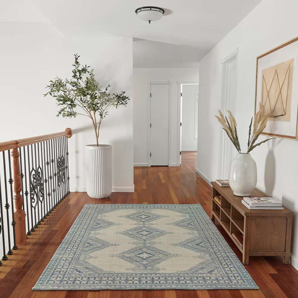 Styled in a hallway, Momeni Anatolia Indoor Rug - ANA-10 Ivory adds a touch of classic charm and warmth to wood flooring