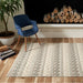 Styled in a living room, Momeni Andes Indoor Rug - AND-10 Ivory adds warmth with its modern geometric stripes