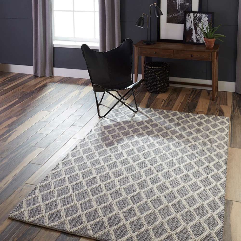 Styled in a living room, Momeni Andes Indoor Rug - AND-7 Grey adds warmth and texture with its contemporary diamond design