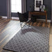Styled in a modern living space, Momeni Andes Indoor Rug - AND-7 Charcoal adds warmth and elegance with its geometric pattern