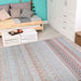 Styled in a cozy room, the Couristan Cape Indoor/Outdoor Rug - Gables/Hibiscus complements wooden furniture and bright turquoise walls with its colorful woven design