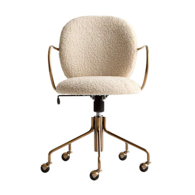 Stylish workspace featuring Crate & Barrel Luna Ivory Boucle Upholstered Office Chair at a wooden executive desk