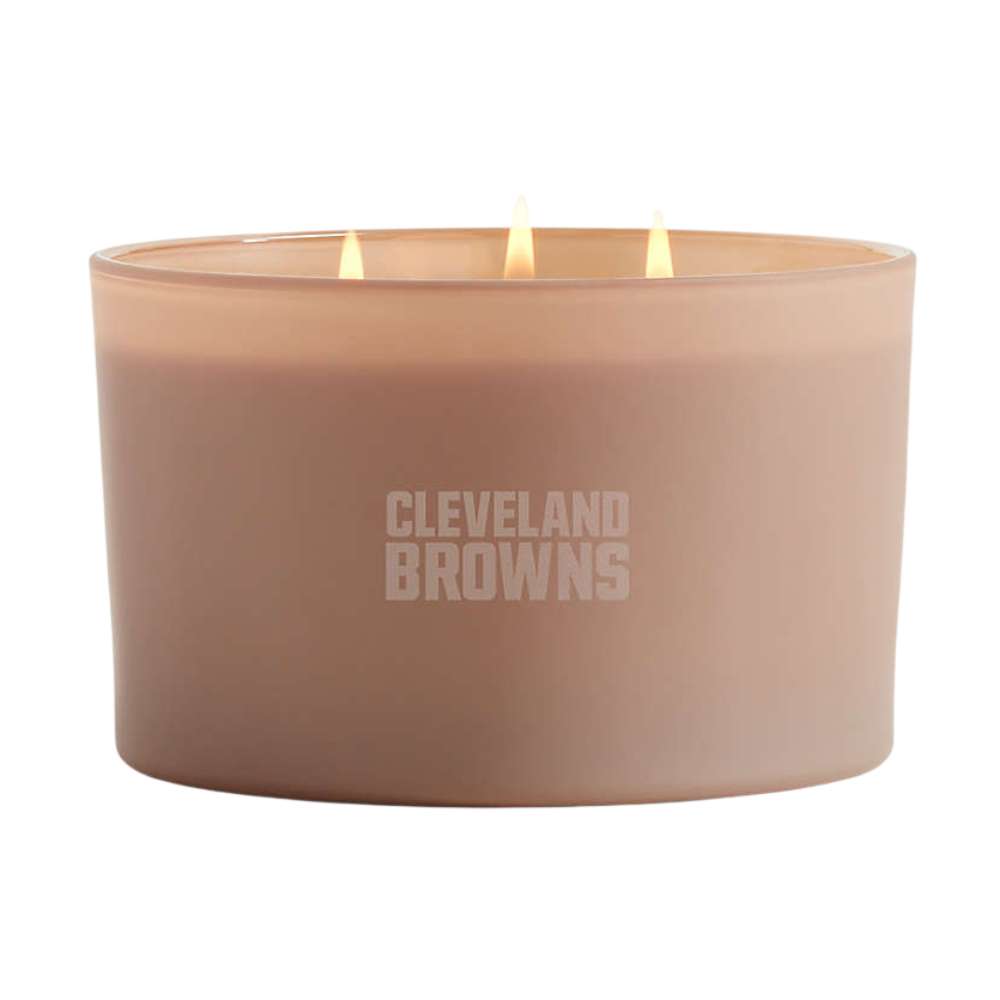 Suede brown three-wick Crate & Barrel Monochrome Scented Candle featuring Cleveland Browns lettering on the wide glass vessel