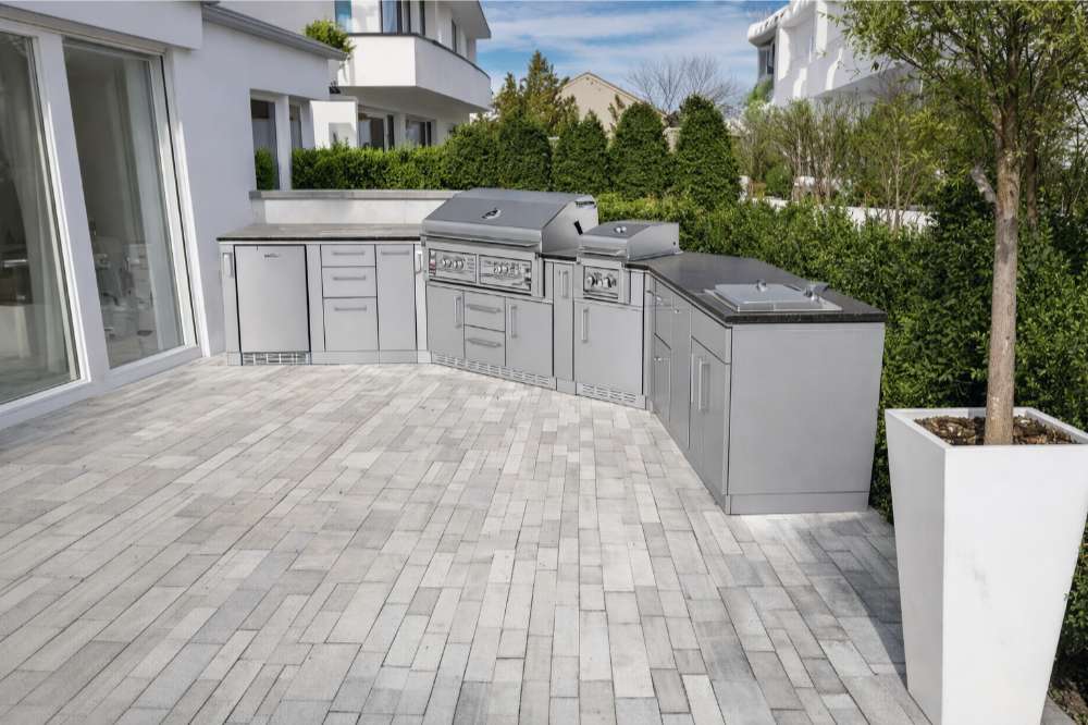 Sunstone Big-Texan 21ft Outdoor Cabinet large Island Package shown as a sleek stainless steel outdoor kitchen with grill and storage on a modern patio