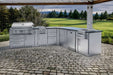 Sunstone Savanna 16ft Outdoor Cabinet Package with 60° Angle sits on a stone patio with a grill, burner, fridge, and sink facing a scenic golf course