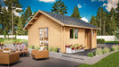 Surrounded by modern outdoor seating and lush greenery, the GardenHouse24 USA Melanie 70 Garden Room appears inviting with its clean wooden exterior and flower boxes
