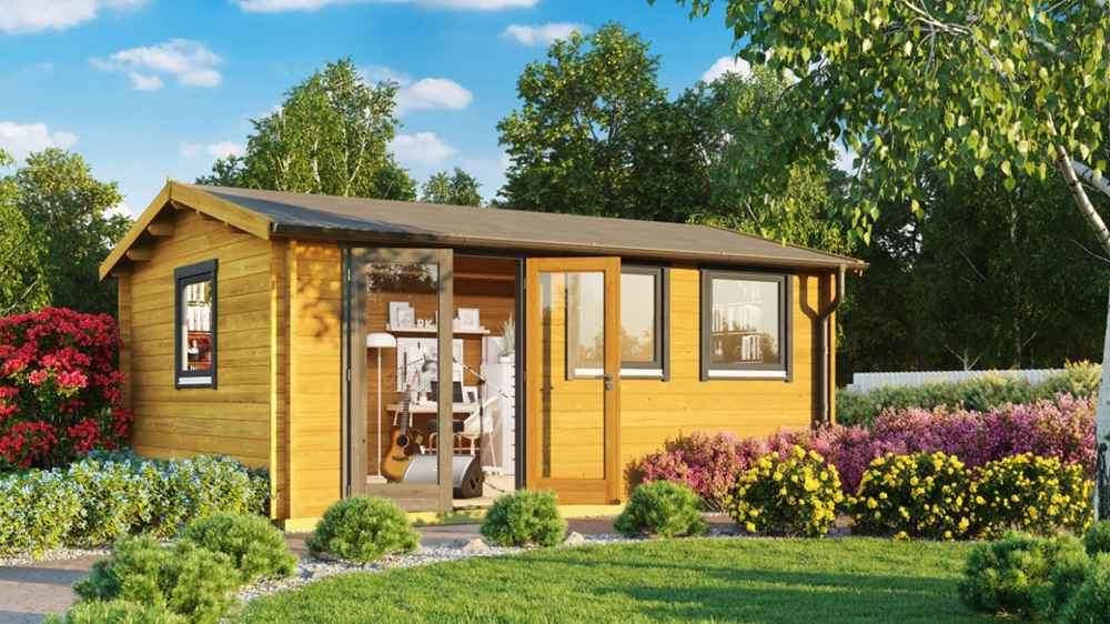 Surrounded by vibrant flowers and green shrubs, the GardenHouse24 USA Miriam 44A Classic Garden Room sits in a lush garden with a clear glass door revealing a cozy interior