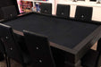 Surrounded by black chairs, the Game Theory Tables Origins Modular Large Game Table showcases a felt playing surface