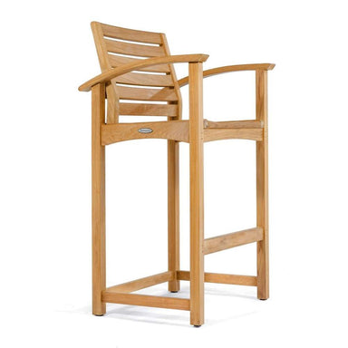 Tall wooden bar chair with armrests and a slatted back is shown on a plain background, highlighting the natural teak finish of Westminster Teak Somerset Teak Bar Stool
