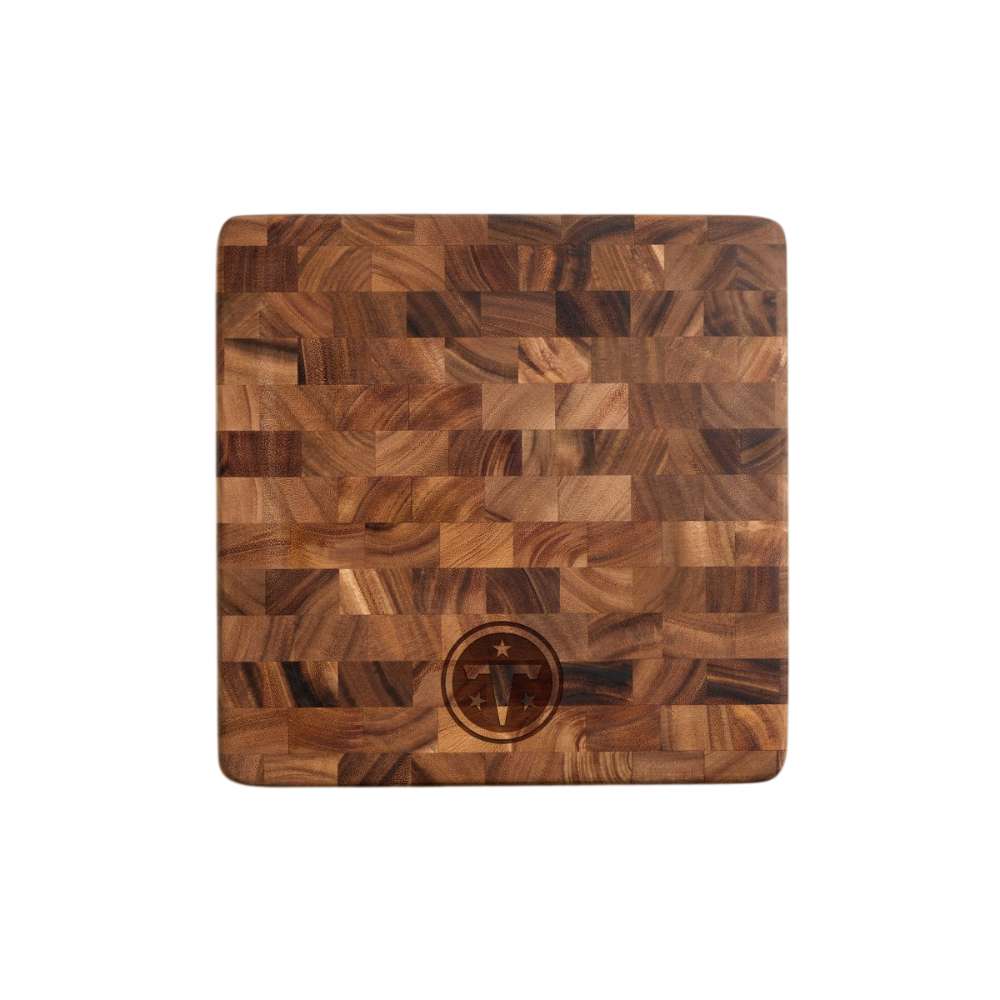Tennessee Titans Crate & Barrel NFL Square End Grain Cutting Board features a square end-grain wood surface with the Titans logo engraved near the bottom