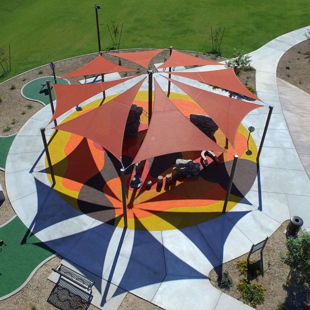 Tenshon Equilateral Triangle Shade Sail canopy shades a colorful outdoor playground seating area