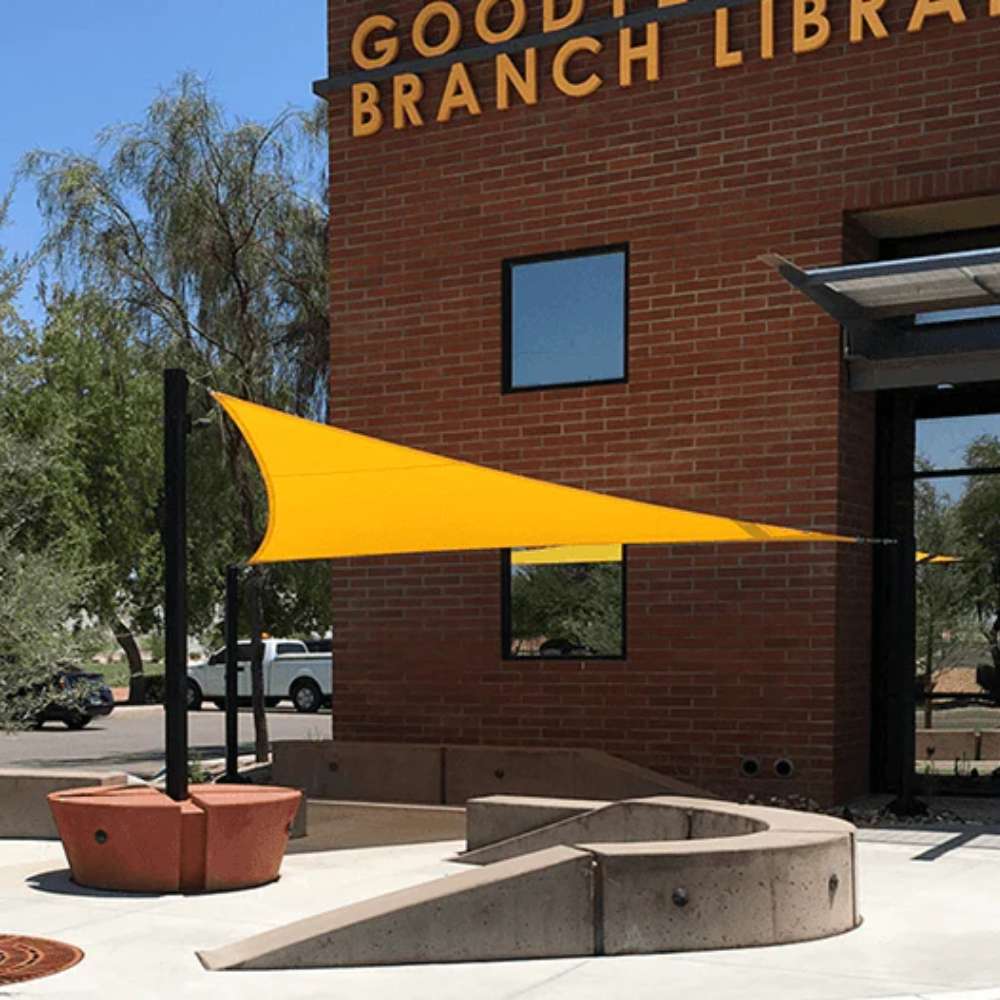 Tenshon Equilateral Triangle Shade Sail installed beside a building for outdoor sun protection