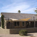 Tenshon Rectangle Shade Sail above a fenced residential patio, adding shade beside a stucco home