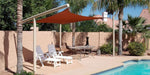 Tenshon Rectangle Shade Sail over a backyard pool patio with lounge chairs and outdoor seating