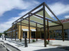Tenshon Rectangle Shade Sail over a commercial walkway with large fabric panels stretched across a steel frame