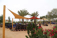 Tenshon Right Triangle Shade Sail stretched between wooden and metal posts in a garden center