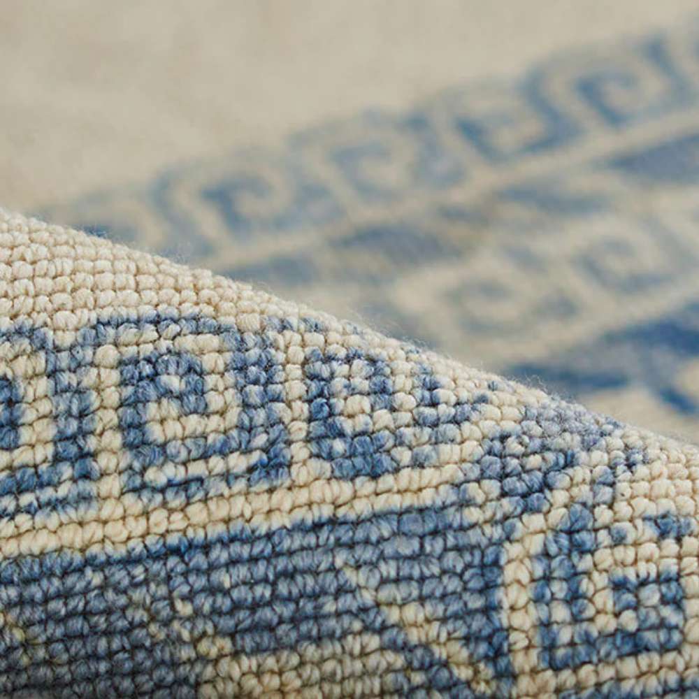 Textured view of Momeni Anatolia Indoor Rug - ANA-10 Ivory shows its woven surface with soft blue geometric details