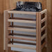 The Harvia stove for Golden Designs Soria 3 Person Indoor Hybrid Sauna with Full Spectrum IR and Harvia Stove mounted on a cedar wall inside a slatted light wood safety guard