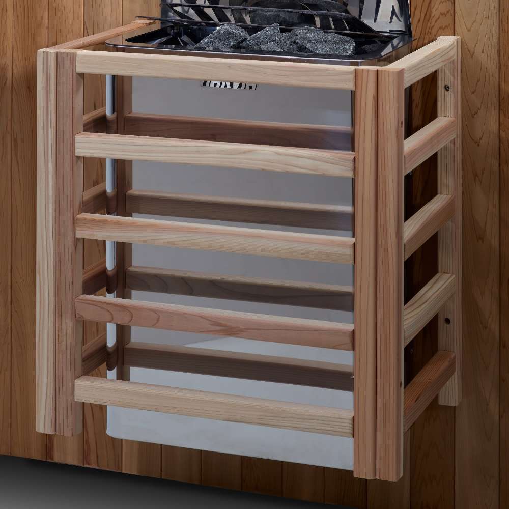 The Harvia stove for Golden Designs Sundsvall 2 Person Traditional Sauna mounted on a cedar wall inside a slatted light wood safety guard