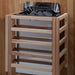 The Harvia stove for Golden Designs Toledo 6 Person Indoor Hybrid Sauna with Full Spectrum IR and Harvia Stove mounted on a cedar wall inside a slatted light wood safety guard