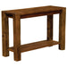 The image shows Fireside Lodge Barnwood Post Sofa Table, a simple rustic wooden table with thick legs and a lower shelf