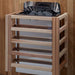 The stove in Golden Designs Osla 6 Person Traditional Sauna hangs on a cedar wall inside a slatted light wood safety guard