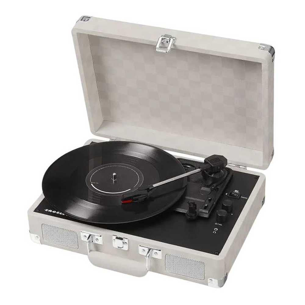 The Crosley Cruiser Plus Portable Turntable with Bluetooth InOut - Almond Checkerboard is shown open with a sleek vinyl record spinning on its platter