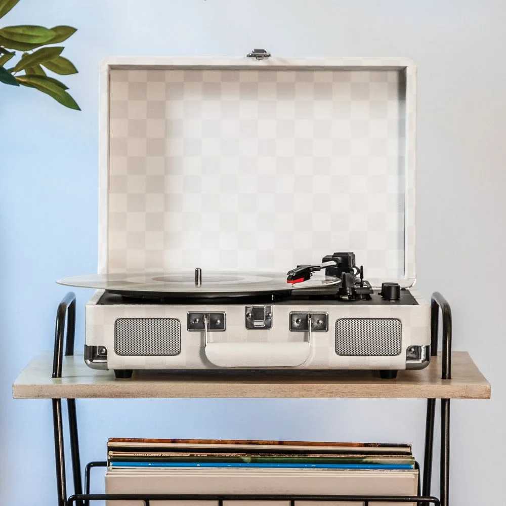 The Crosley Cruiser Plus Portable Turntable with Bluetooth InOut - Almond Checkerboard sits on a wooden shelf, open with a vinyl record spinning