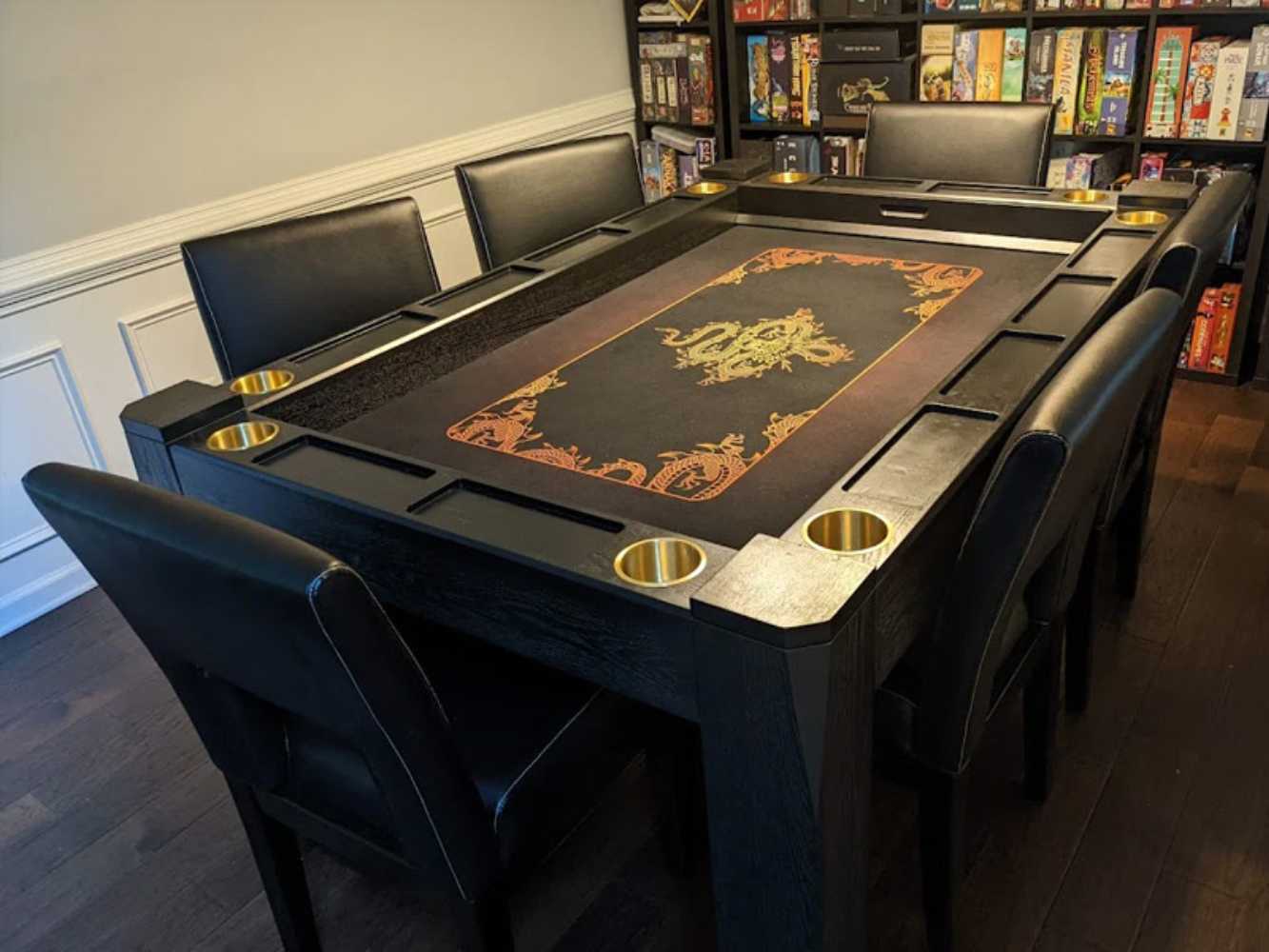 The Game Theory Tables Origins Lit Game Table features a classy black design with golden cup holders