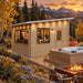 The Eze Breeze Sunroom Cabin Freedom Office at golden hour in Colorado, featuring friends gathered around a compact bar beside a hot tub, fire feature, golden aspens, and rugged mountain scenery.

