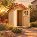 The Wee Wee House 33 outdoor bathroom with its door open, surrounded by drought-tolerant landscaping in a Nevada backyard during warm golden-hour sunlight.