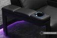 The armrest with built-in cup holders and controls combines functionality and style in the Valencia Monza Pillow Top Carbon Fiber Home Theater Seating