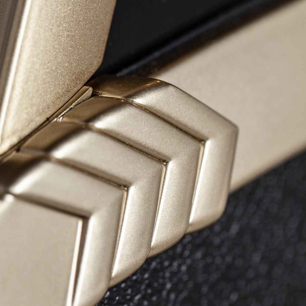 The chevron-style metallic corner detail of the Marshall Rocket Full Size LP Jukebox - Black