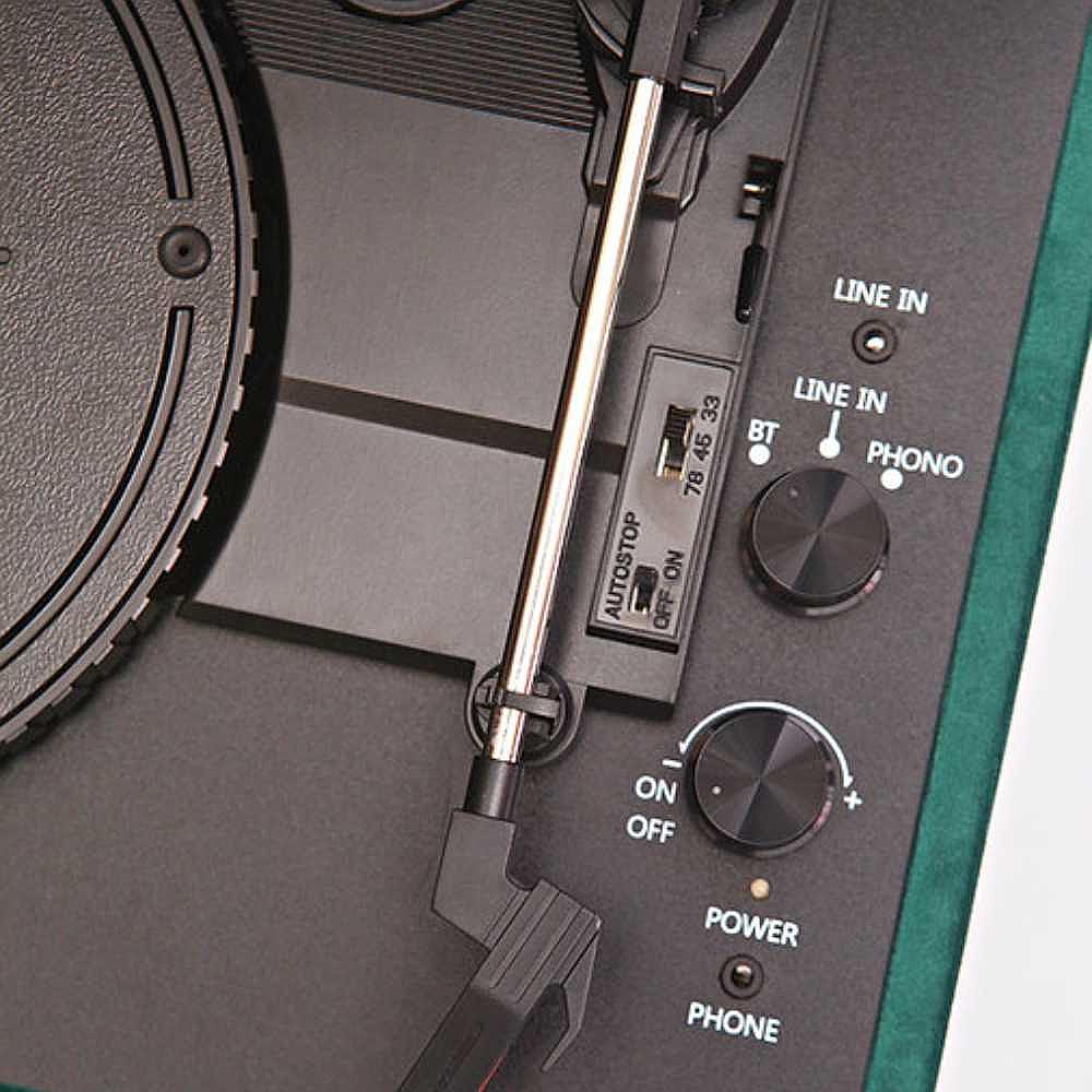 The close-up image of the control panel on Arkrocket Curiosity Suitcase Bluetooth Turntable (Green Velvet) with power and input switches for Bluetooth and phono modes