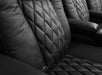 The close-up image shows the luxurious diamond-stitched leather of the Valencia Tuscany Single Home Theater Seating