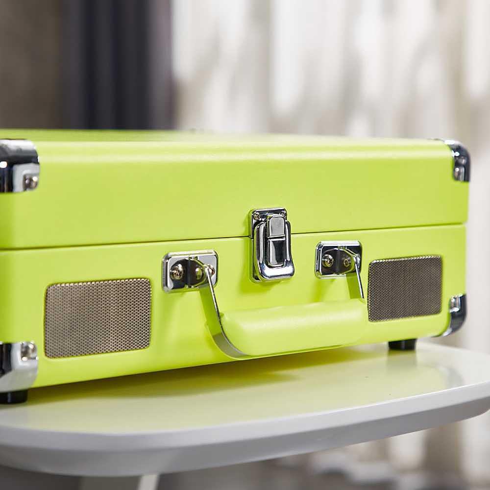 The closed Arkrocket Curiosity Suitcase Bluetooth Turntable (Neon Yellow) appears like a portable suitcase with metallic clasps and built-in front speakers