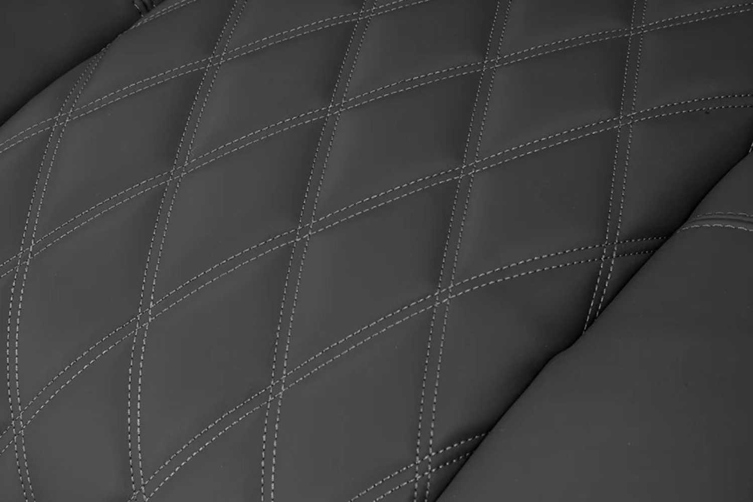 The detailed diamond-patterned stitching on the premium leather upholstery of the graphite Valencia Tuscany XL Luxury Edition Home Theater Seating