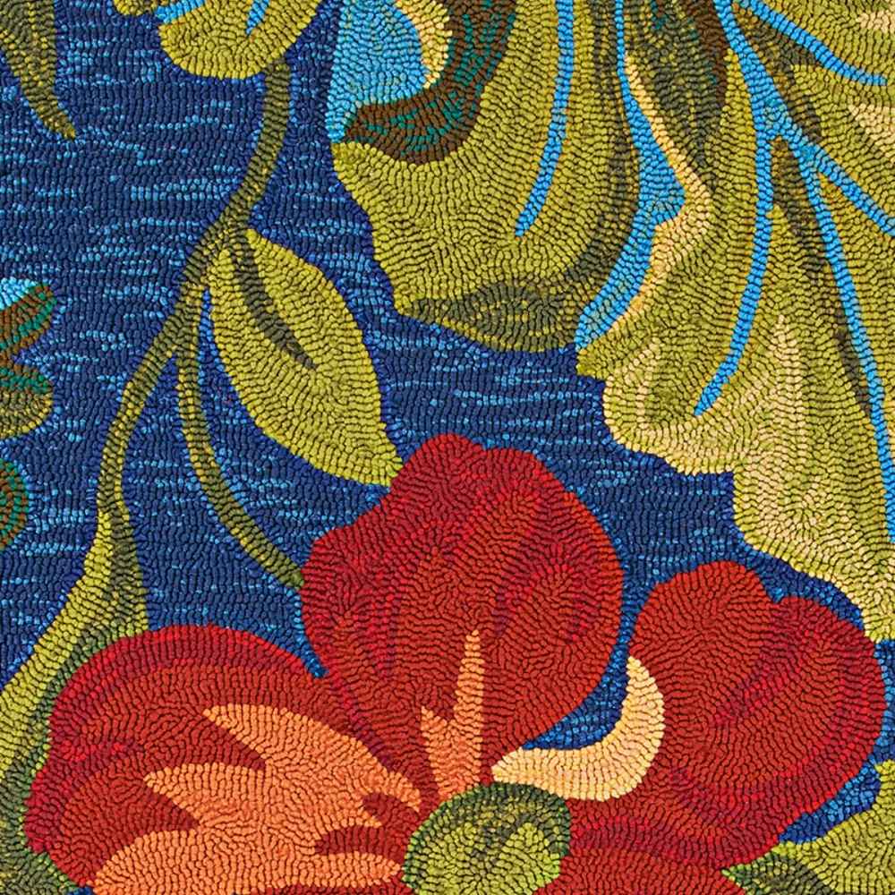The floral detail of the Couristan Covington Indoor/Outdoor Rug - Tropical Orchid/Azure-Forest Green-Red pops with red petals and layered foliage