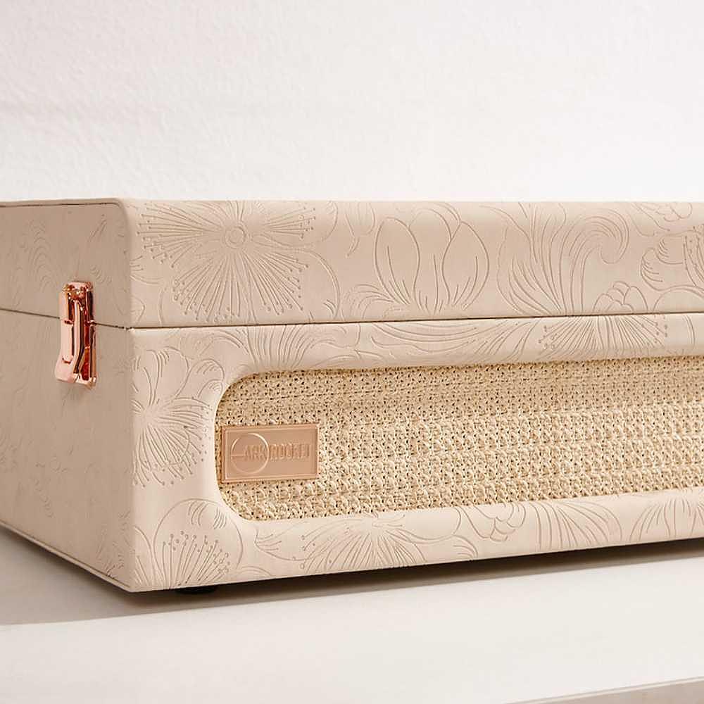 The front panel of Arkrocket Coryphaeus Bluetooth Turntable Deluxe Edition Record Player (Flora Engraved) highlights its woven speaker grille and engraved floral design