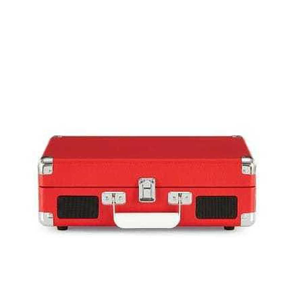 The front view of the Crosley Cruiser Plus Portable Turntable with Bluetooth InOut - Exclusive Red Vinyl showcases its built-in speakers and portable latch design