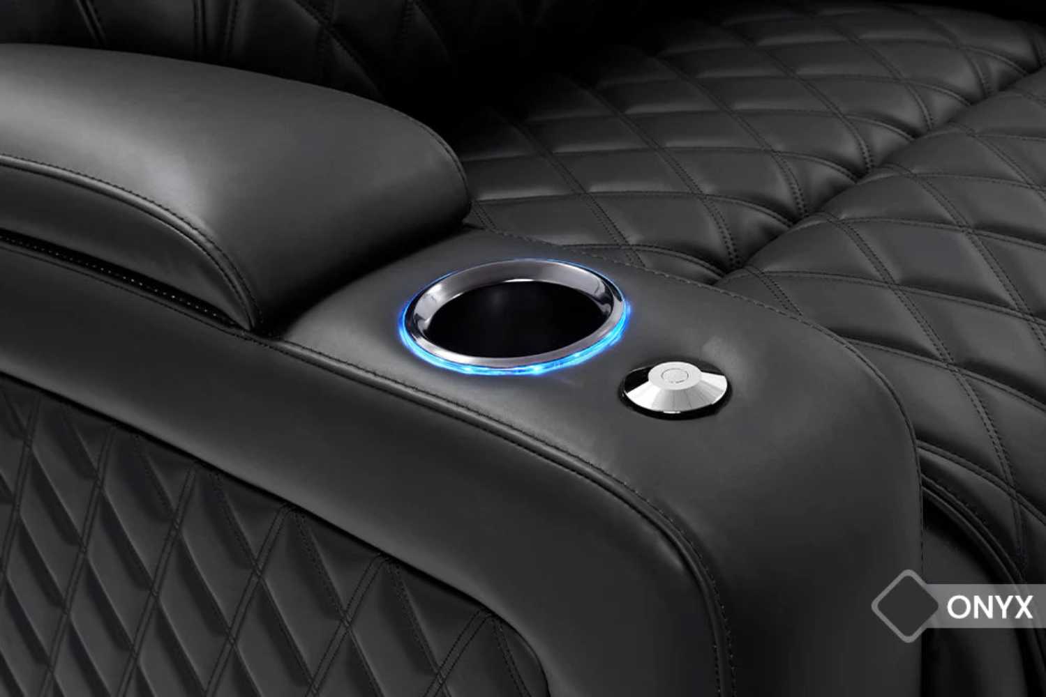 The illuminated cup holders of the Valencia Oslo Luxury Single Home Theater Seating