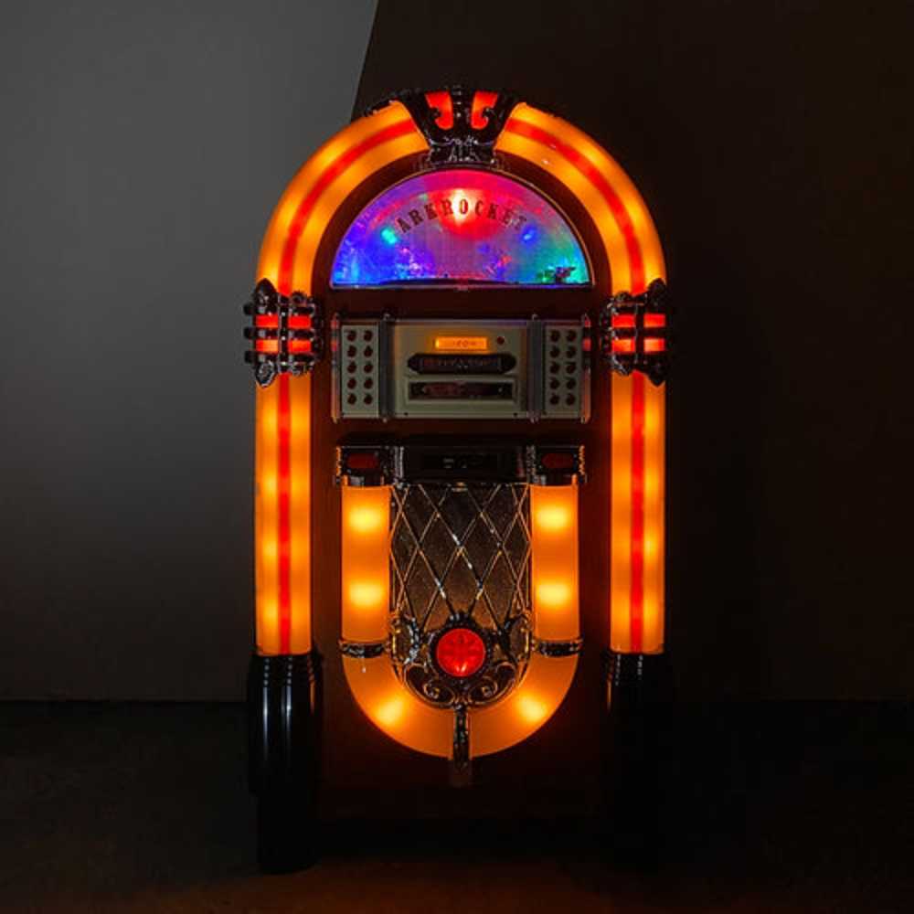 The image displays the Arkrocket Taurus Jukebox - Classic 2024 New Upgrade glowing with warm, orange lighting in a dimly lit room