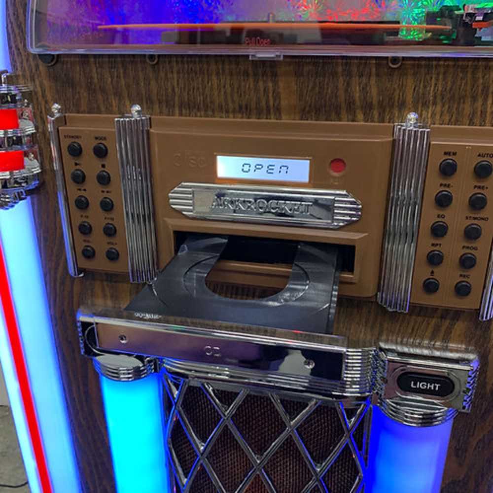 The image focuses on the CD player tray of the Arkrocket Taurus II Jukebox - Dark Oak 2024 New Upgrade with an open display on the control panel