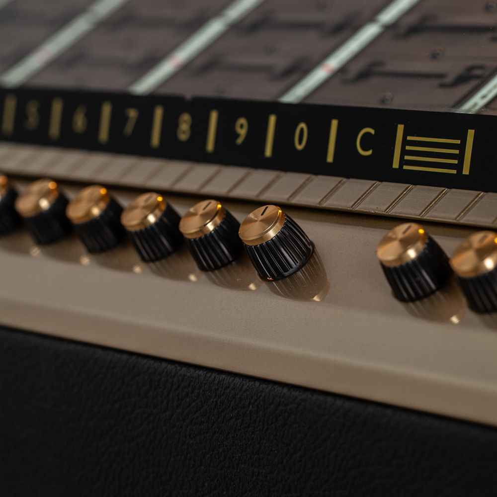 The image focuses on the gold-accented control knobs of the Marshall Rocket Full Size LP Jukebox - Black, set against its song selection display