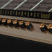 The image focuses on the gold-accented control knobs of the Marshall Rocket Full Size LP Jukebox - Black, set against its song selection display