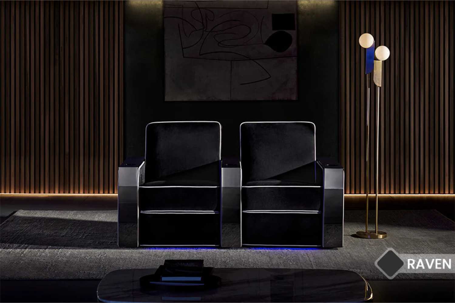 The image portrays two Valencia Naples Elegance Home Theater Seating chairs in a sophisticated home theater setting with ambient lighting