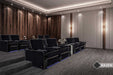 The image reveals a luxurious home theater setup featuring multiple rows of Valencia Naples Elegance Home Theater Seating