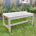 The image shows the LuxCraft Cafe Dining Bench 41 placed on a grassy lawn